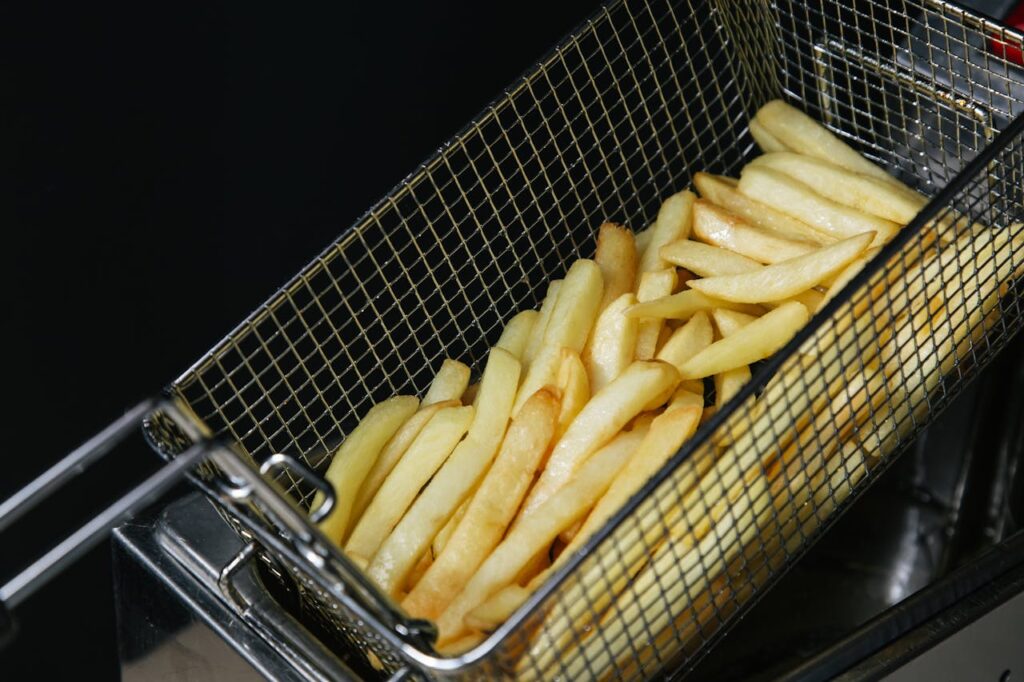 Crispy French Fries in the Metal Strainer